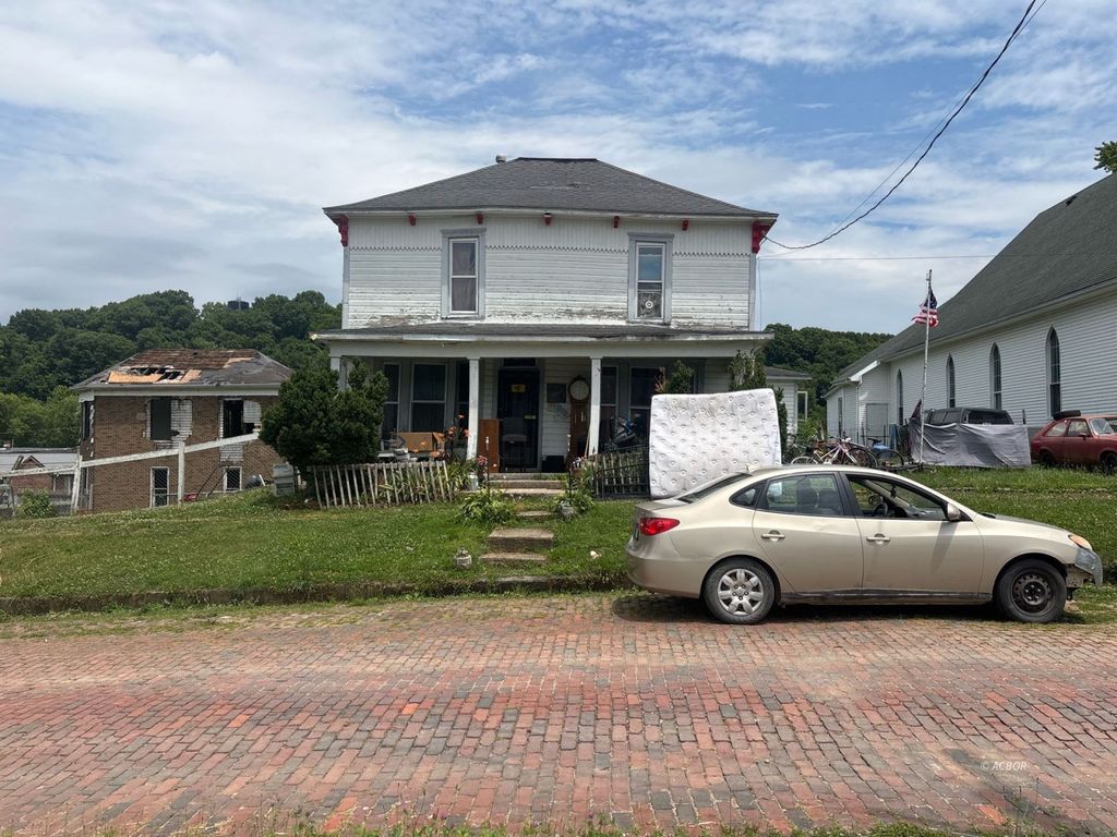 Photo of 11 Cherry St, Glouster, OH 45732 (MLS # 2435192)