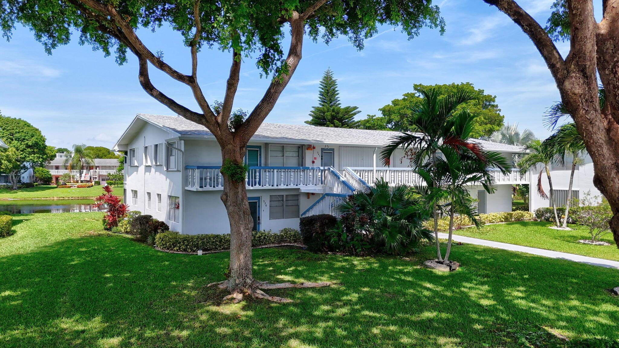 Welcome to this bright and spacious 2-bedroom, 2-bathroom garden-level corner condo featuring serene water views of the lake. The open layout is perfect for both everyday living and entertaining, with natural light streaming in through the additional corner windows. Step outside to your private patio and enjoy peaceful sunrises and tranquil evenings overlooking the water.Located in Century Village, a 24/7 gated, active 55+ resort-style community, residents enjoy a wealth of amenities including a clubhouse, fitness center, tennis, pickleball, billiards, mini golf, a community bus, and more. Just minutes from Deerfield Beach, shopping, and dining, this condo offers the best of convenience and leisure.