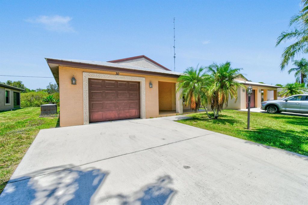 Photo of 30 Mediterranean Boulevard N, Port Saint Lucie, FL 34952 (MLS # R11007750)