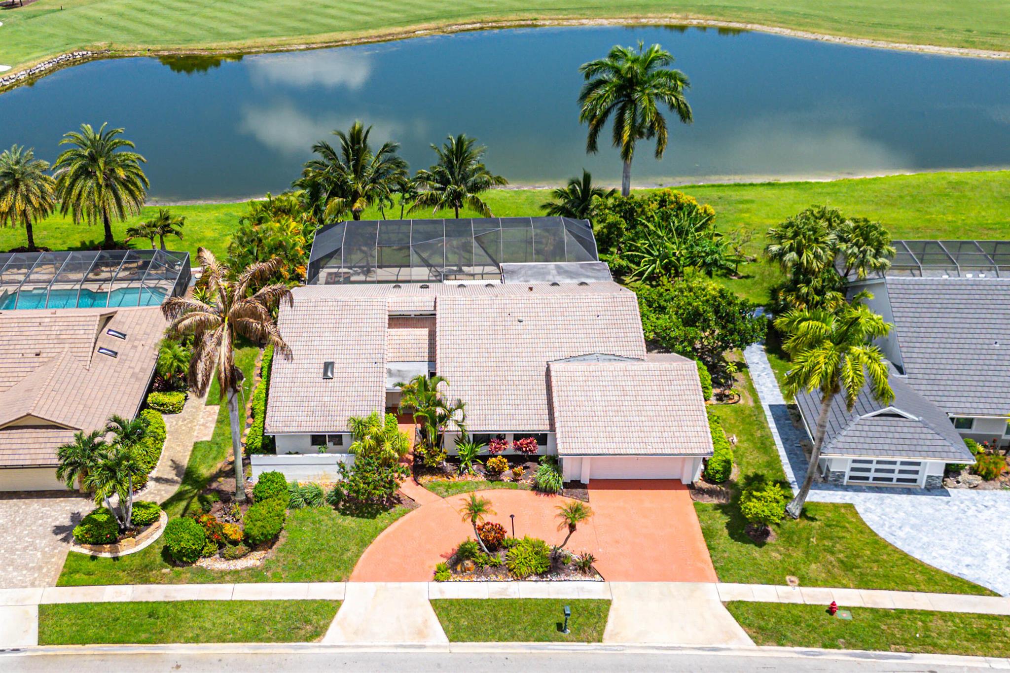 Beautifully renovated 3-bedroom, 3.5-bath home showcasing stunning golf and water views. Enjoy the private, screen-enclosed pool and spacious open floor plan--ideal for relaxing or entertaining. Includes FULL GOLF membership. Boca Woods is an all age Country Club Community which offers resort style amenities, including two championship golf courses, Har Tru tennis courts, pickleball courts, state of the art fitness center, spa, game room, fully renovated clubhouse with fine dining and much more! Don't miss this incredible opportunity!