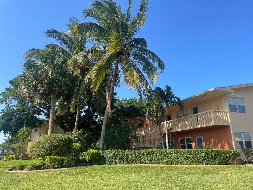 55+ 1 BR 1.5 BA 2nd floor unit with western & eastern exposures. Hurricane windows, doors, and newer roof (2022). NEW electrical panel. Custom shelving in the llving room. Walk-in closet and ample storage space throughout. Water filtration system installed in kitchen. Finished, enclosed porch (1983) off bedroom. Renovated bathrooms; walk-in shower. Unit surrounded by Zen-like lush landscaping.  Well-managed association. Pet friendly. No rentals. 2024 assessment for electrical room PAID IN FULL.