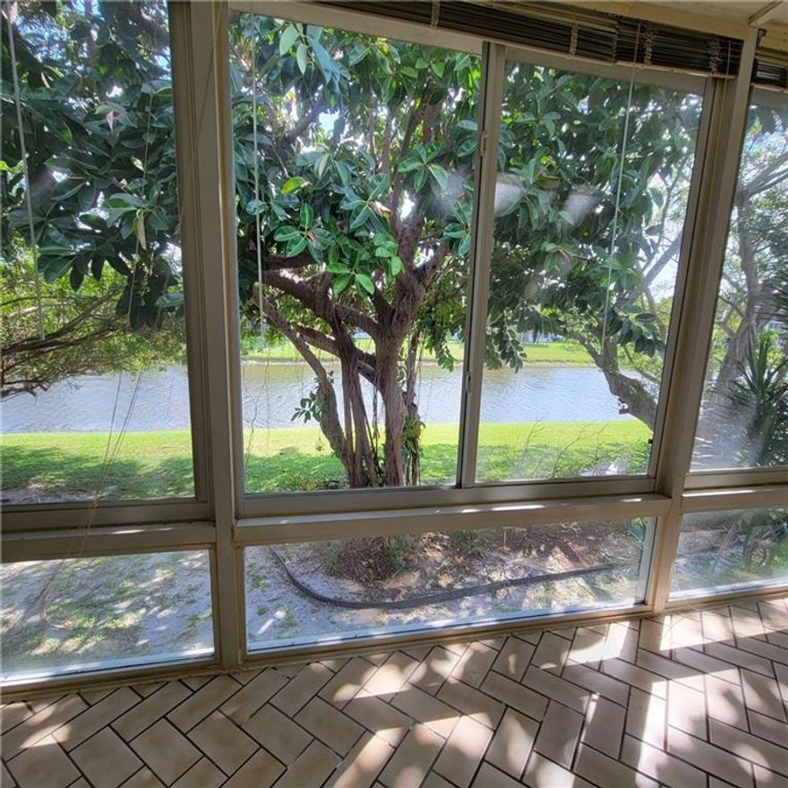 Handyman special! Second floor 1 bedroom 1, 5 bath  located in a quiet  building with a barbecue patio on the water.  Beautiful water view from the new enclosed patio. Century Village is 55+ community where the residences enjoying  resort style living with low maintenance. Amenities include club house, large swimming pools, theater, tennis, free transportation and much more.