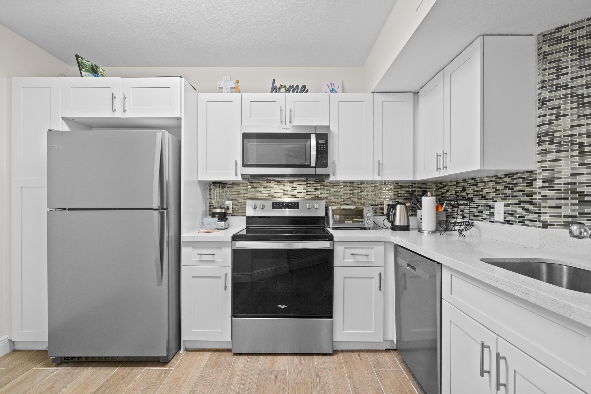Welcome to Edgewater, a gated community in the heart of Coral Springs. This 2/2, 3rd flr Unit features a split floor plan, high ceilings, and an open-concept layout with ample natural light, perfect for relaxing and entertaining. Step into a modern kitchen with quartz countertops, white cabinetry and a breakfast bar that opens to the dining and living areas. The full-size W/D are conveniently located inside the unit. The master bdrm offers a walk-in closet and en-suite bathroom. Amenities include: 2 pools, hot tub, children's wading pool, tennis courts, Child play area, two-story gym w/cardio & weight equipment, dog park, BBQ Area, and Clubhouse. Edgewater is located close to shopping, dining, parks, top-rated schools, easy access to major highways & investor friendly, rent immediately!!!