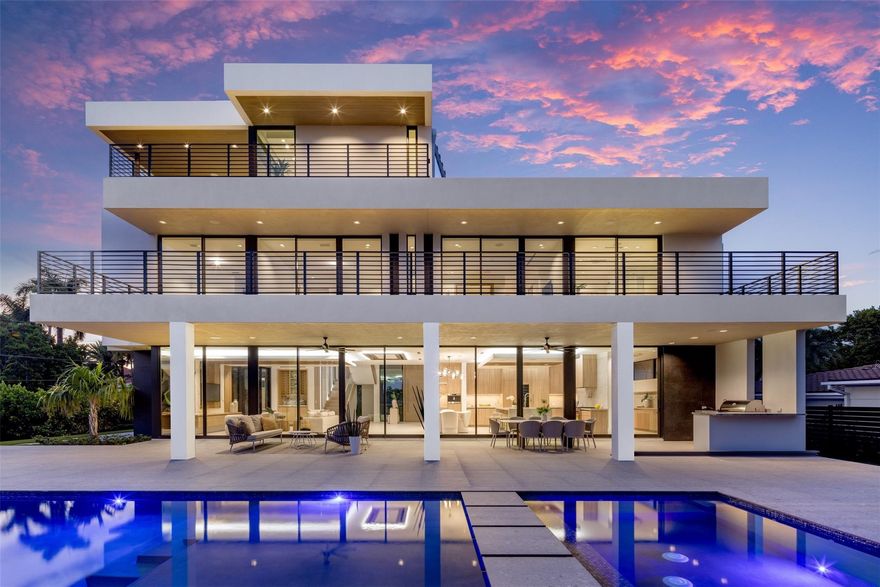 A 3-story masterpiece on a 15,500 sf lot in Fort Lauderdale's most exclusive gated beachside neighborhood. Just a short walk to the ocean and 2 miles from Las Olas shopping & dining. Designed by Tuthill Architecture redefining coastal sophistication w/ sleek designs, floor to ceiling glass windows & doors. Over 9,000 sf of outdoor and indoor living space, including a 3rd-floor sky lounge with indoor/outdoor kitchen, 1/2 bathroom overlooking Lake Sylvia and the downtown Fort Lauderdale skyline. Complete privacy wall surrounds the gated compound, and the floorplan embraces a seamless indoor-outdoor transition from every floor. A private elevator provides easy access to every level. Owners can join the Harbor Beach Surf Club, offering 300 feet of private beach access boat slips & more.