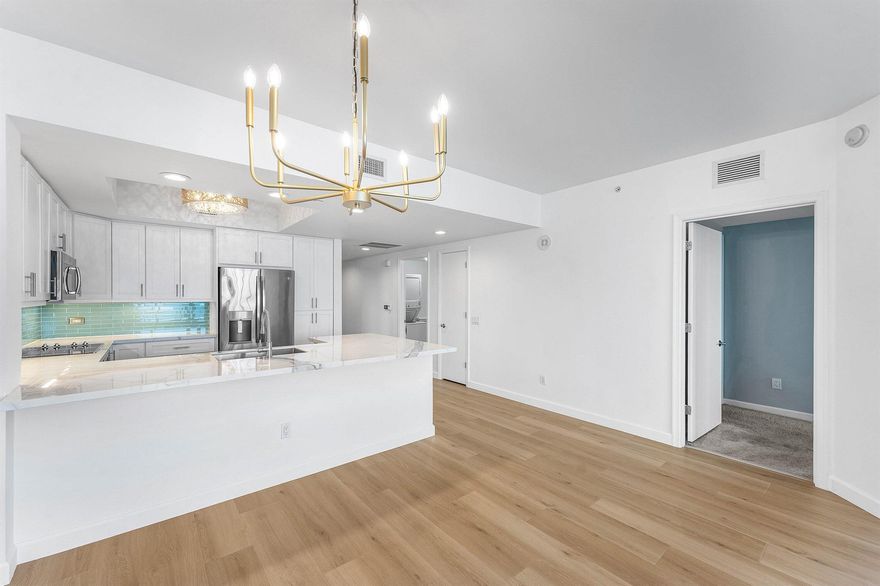 Recent $90,000 remodel! Beautifully upgraded 15th floor 3BR/3BA, panoramic Intracoastal view. New LVT flooring in living areas & new paint thru-out! LED lights Remodeled kitchen w  Italian Sapien Stone porcelain counters, solid wood cabinetry, glass tile backsplash, GE appliances. His & her custom walk-in closets. Marble primary bath w jetted bath, frameless shower, double vanities, & water closet. Split floor plan. Special Assessment paid by seller. Semi-private fob elevator access. NEWLY RENOVATED rooftop oasis w/pool, spa, BBQ areas, tennis, pickleball, bocce. Clubhouse, billiard room, fitness center., sauna. 24 hr manned gate, temperature controlled storage, walk to Publix. Adjacent marina w/dry docks available, be on the ocean in minutes; no fixed bridges! Pet friend