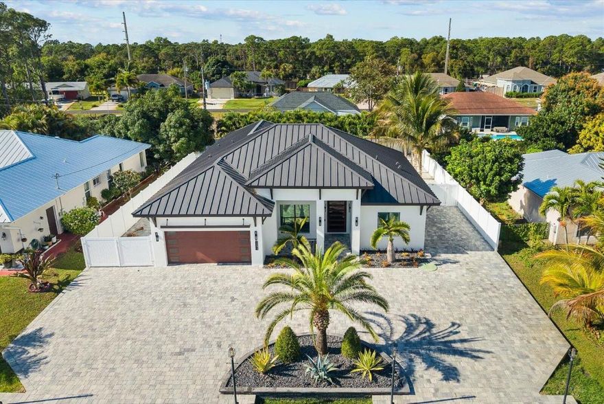 ***Spectacular Swimming Pool 4BR/4BA/2 Car Garage Home Built 2022 Upgrades Cannot Be Describe a Most See*** Located: Close to Parks, Schools, Near Tesoro, FL Turnpike, Hospitals. Features: Porcelain 48 x 48 Flooring Throughout, 12 FT Ceilings in Main, 10 Ft Ceilings M-B, 10 x 5 Ft Front Door, Open Kitchen with Quartz, Sub Zero Refrigerator, Marble Wall with Fire Place, Heated Pool with Fire Pit Burner, Fenced, RV parking, much more a must see house.