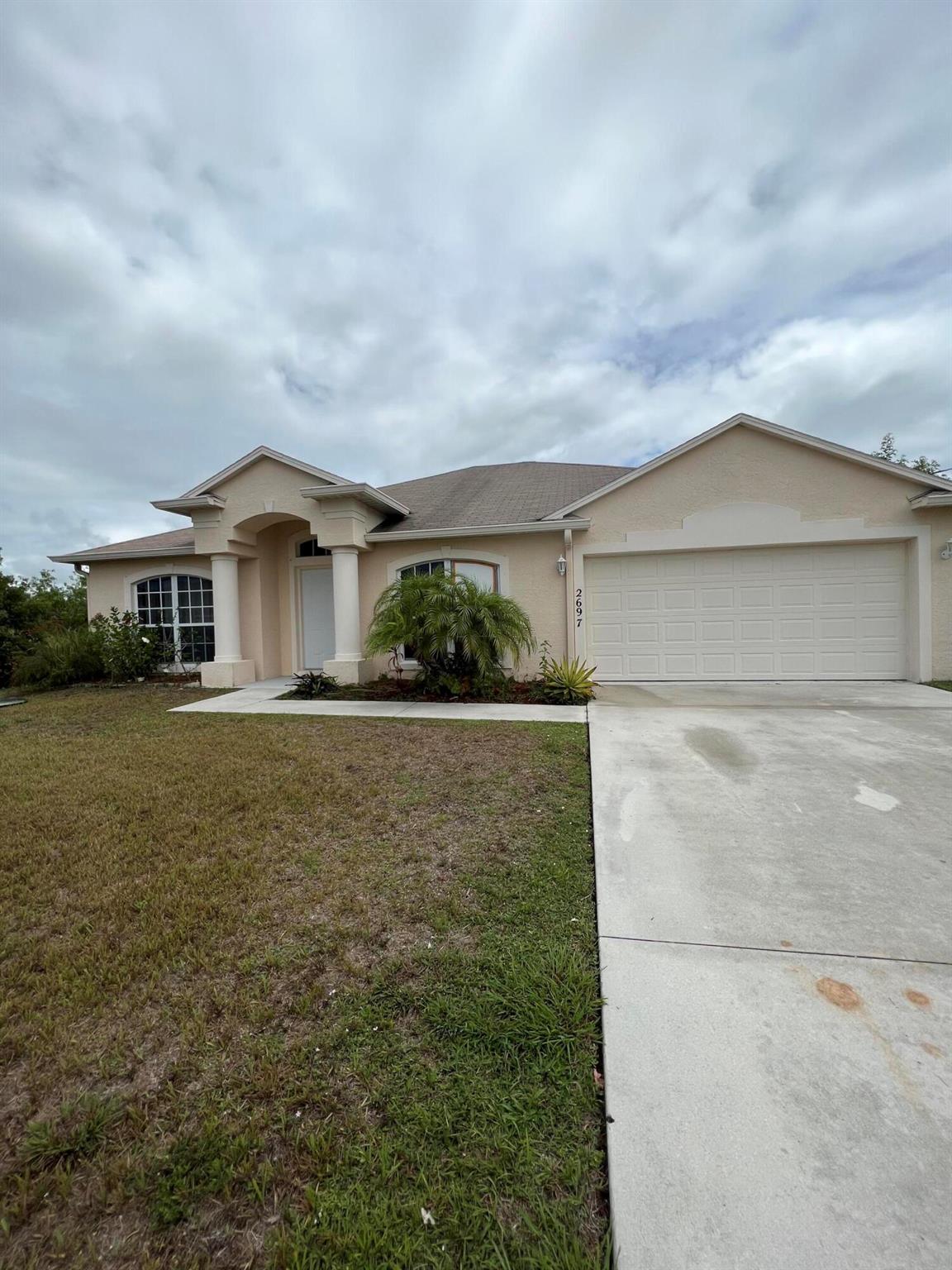 Beautiful home FEATURES CATHEDRAL CEILING, LIVING ROOM, DINING ROOM, EAT-IN KITCHEN, FAMILY ROOM AND MASTER BEDROOM WITH 2 WALK IN CLOSETS, AND JACUZZI TUB. CERAMIC TILE FLOORS IN LIVING ROOM, DINING ROOM, KITCHEN, FAMILY ROOM, HALL, BATHS, TWO SKYLIGHTS, STORM SHUTTERS, UPGRADED CERAMIC TILE IN SHOWERS, COVERED PATIO, 2 CHANDELIERs ,and FOYER LIGHT, storm shutters and nice covered patio 2 car garage CONVENIENT LOCATION NEAR 1-95 AND TRADITION.