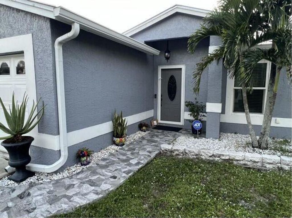 Photo of 5843 SE Grafton Drive, Stuart, FL 34997 (MLS # R11062313)