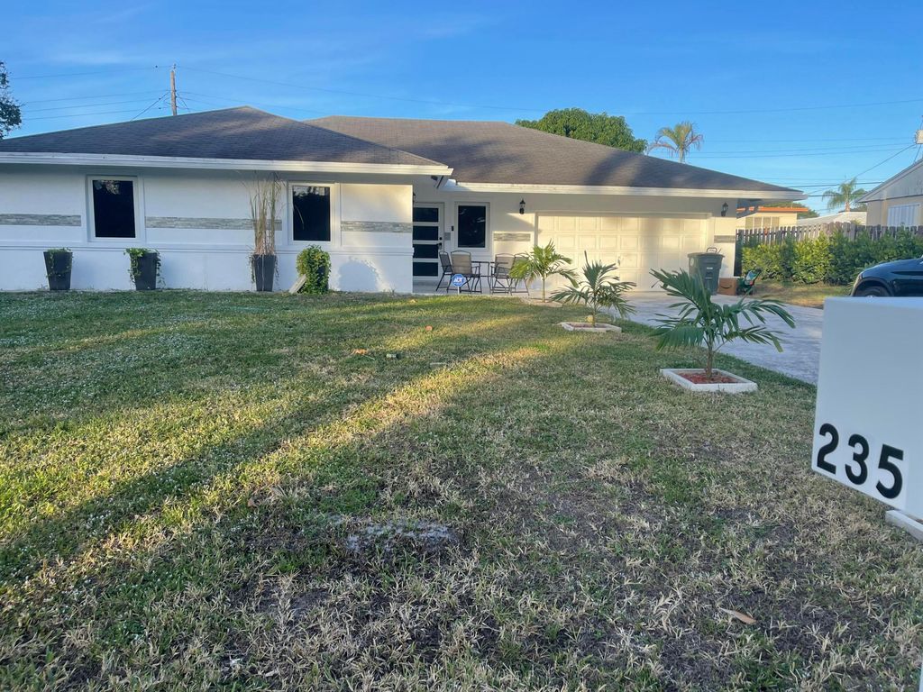 Photo of 235 NW 3rd Court, Boca Raton, FL 33432 (MLS # R11055446)