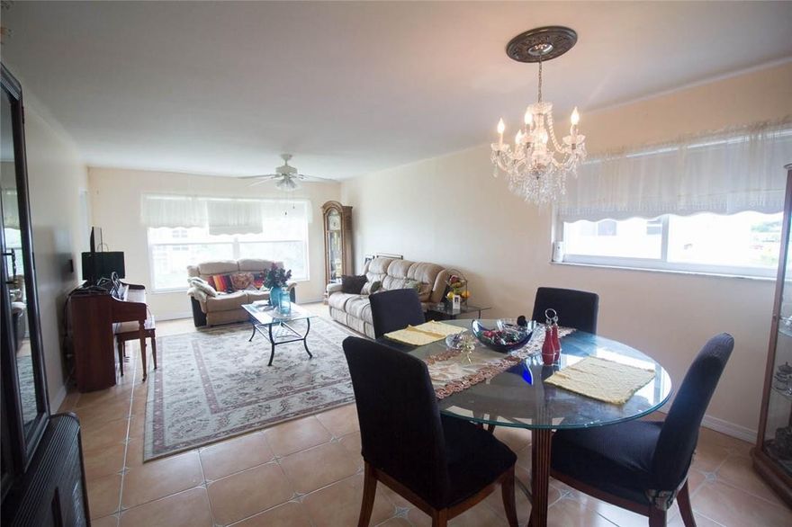This is the one! 2 Bedroom 2 Full Bath top floor corner unit w/ a garden and pool view. Move in ready and can be sold with furniture. Has several hurricane impact windows and door, A/C about 2 yrs old. Corner unit; EXTRA natural light from NW windows. Remodeled kitchen w/granite counter tops and nice cabinets. Tile floor in most of unit, nice laminate wood floor in master. No carpet. Ceilings are flat, no popcorn ceilings here! In the master bedroom you have an extra office or sitting area facing the private grounds and pool area, walk-in closet. Both bathrooms have been updated. Storage unit. Amenities include: BBQ/picnic area, heated pool, shuffleboard, billiard room, community room, clubhouse equipped w/full kitchen, gym, tennis, spa, sauna. Elevator. Assigned parking.