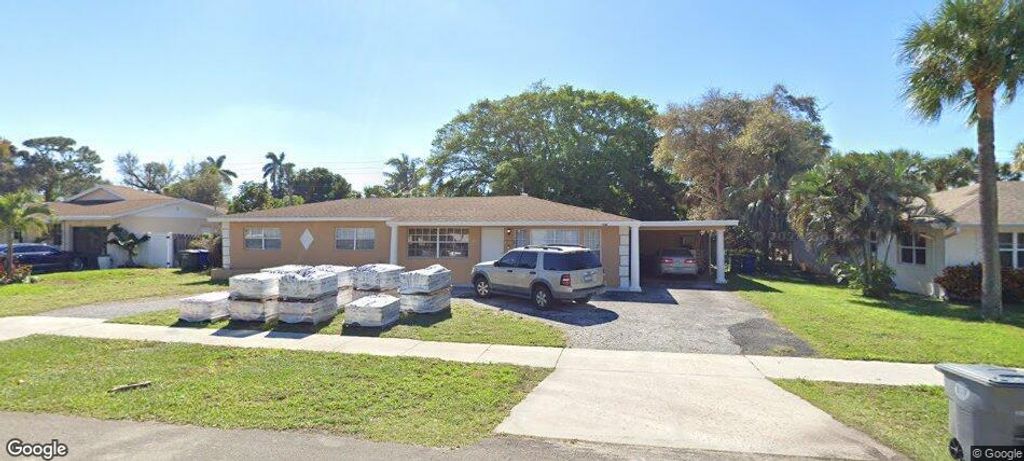 Photo of 446 Date Palm Drive, Lake Park, FL 33403 (MLS # R11152491)