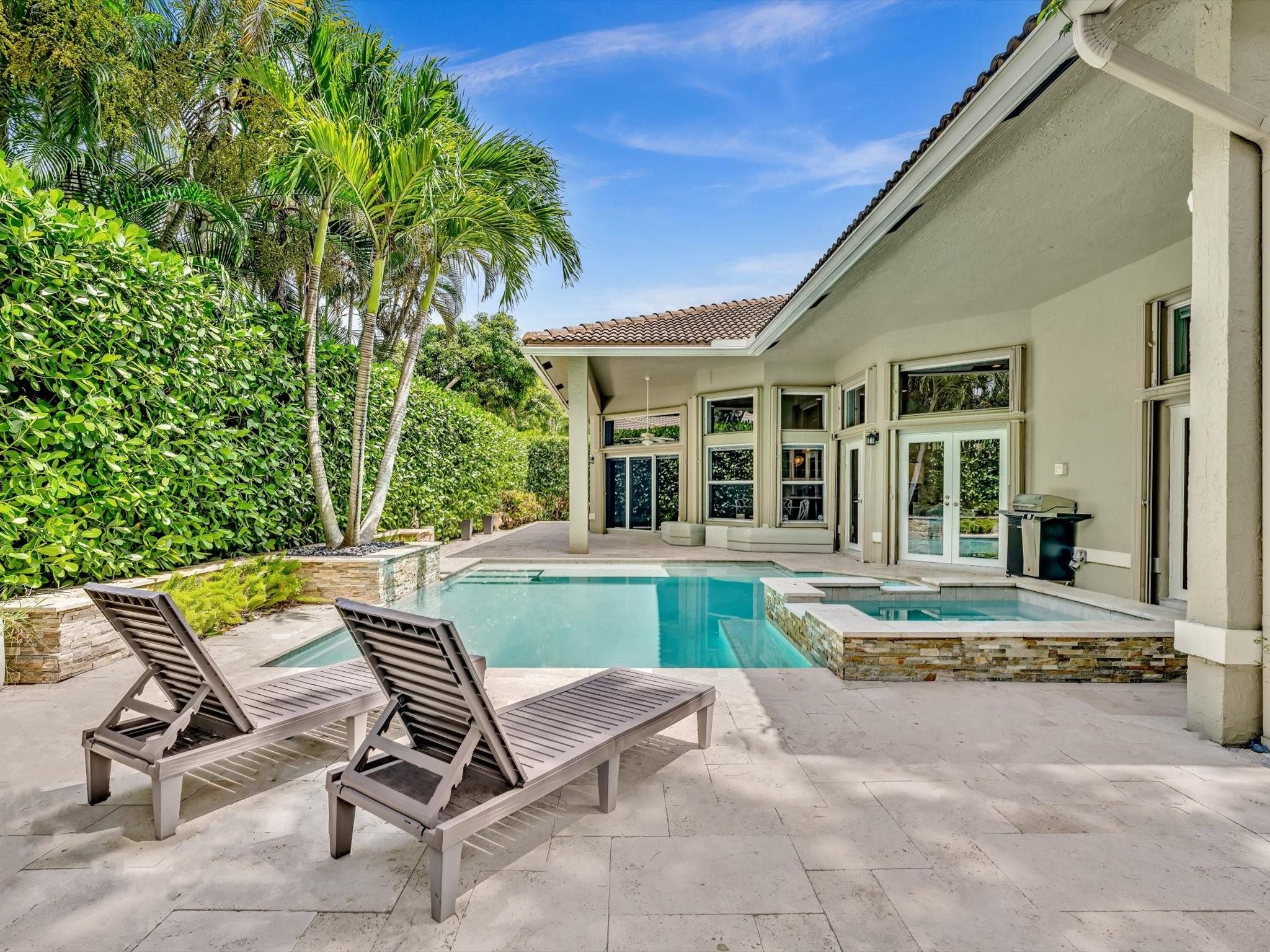 Nestled in sought after Turtle Run Estates, this extraordinary corner lot residence is where contemporary elegance meets timeless comfort. Throughout the home, the 10” x 72” matte rectified porcelain flooring creates a seamless, sophisticated flow. The gourmet kitchen is a culinary enthusiast’s dream, fully equipped with wireless & touchless technology, centered around a stunning quartz waterfall island. Thoughtfully designed interiors feature travertine accent walls with custom built-in shelving, electric fireplaces, wet bar fridge & ambient LED lighting. The home boasts three spa-inspired baths, each with floating vanities & Italian porcelain accent walls. Outdoors, the residence continues to impress with a resort-style pool & spa. Luxury homes of this caliber are exceptionally rare.