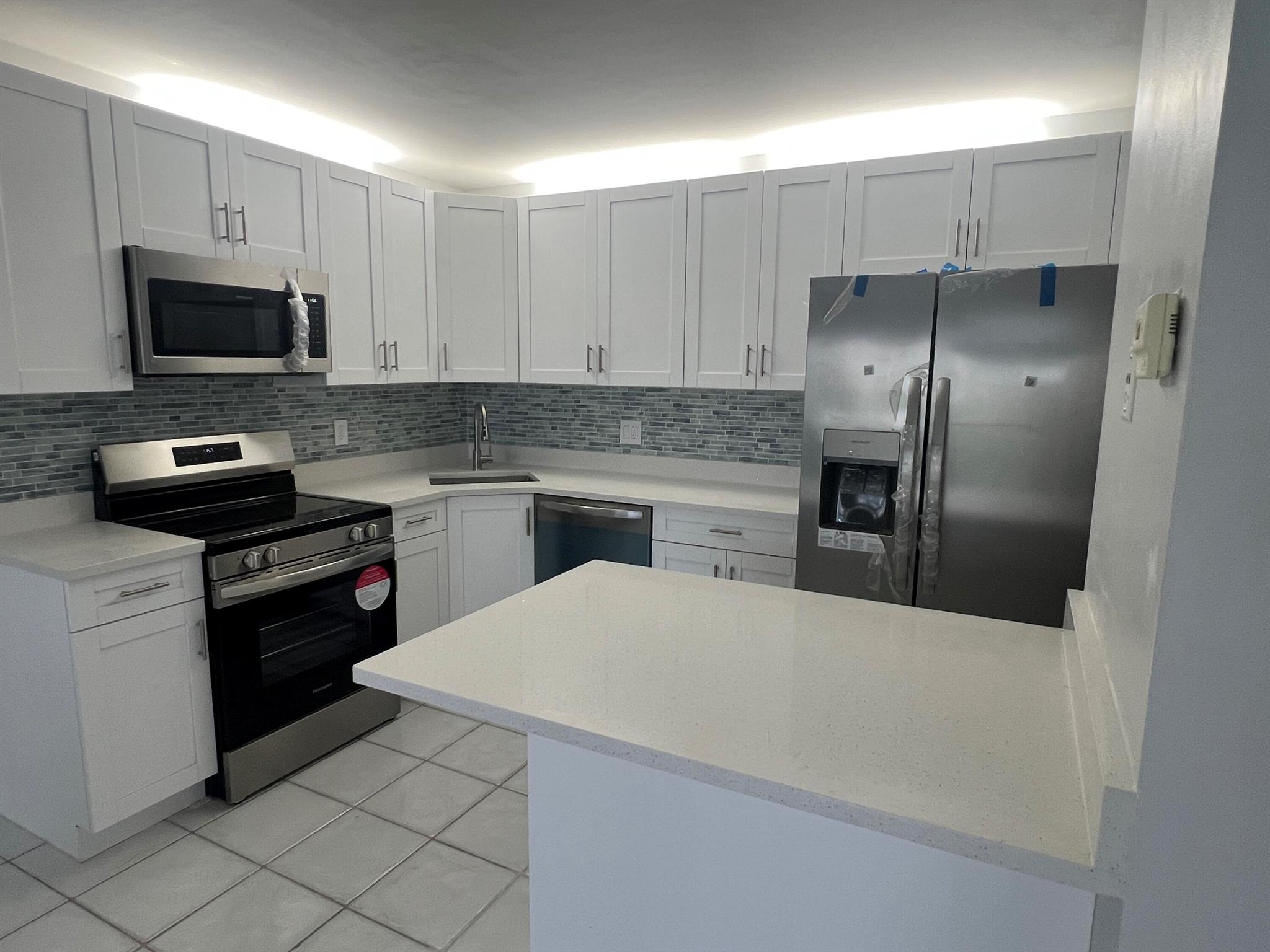 Absolutely amazing 1BE/1BA unit on the first floor with a beautiful lake view in a gated community of Palm Club*Completely renovated -open kitchen with a small island/additional long draws, new cabinets with quartz counter top and SS appliances*, Upgraded bathroom*Spacious walk-in closet*Freshly painted*Screened & covered balcony with water view*No carpet - all tiles here*Newer Front load washer & dryer in the apartment * Water and basic cable included in rent *All ages subdivision * 24 hrs man-gated community * Small pet OK*Great amenities * Central location-close to airport, downtown and beaches*Come and see it before is gone!