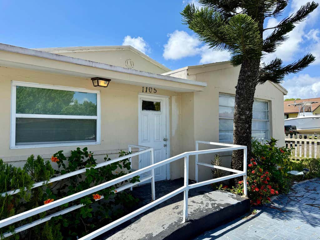 Photo of 1105 W 34th Street, Riviera Beach, FL 33404 (MLS # B26063074)