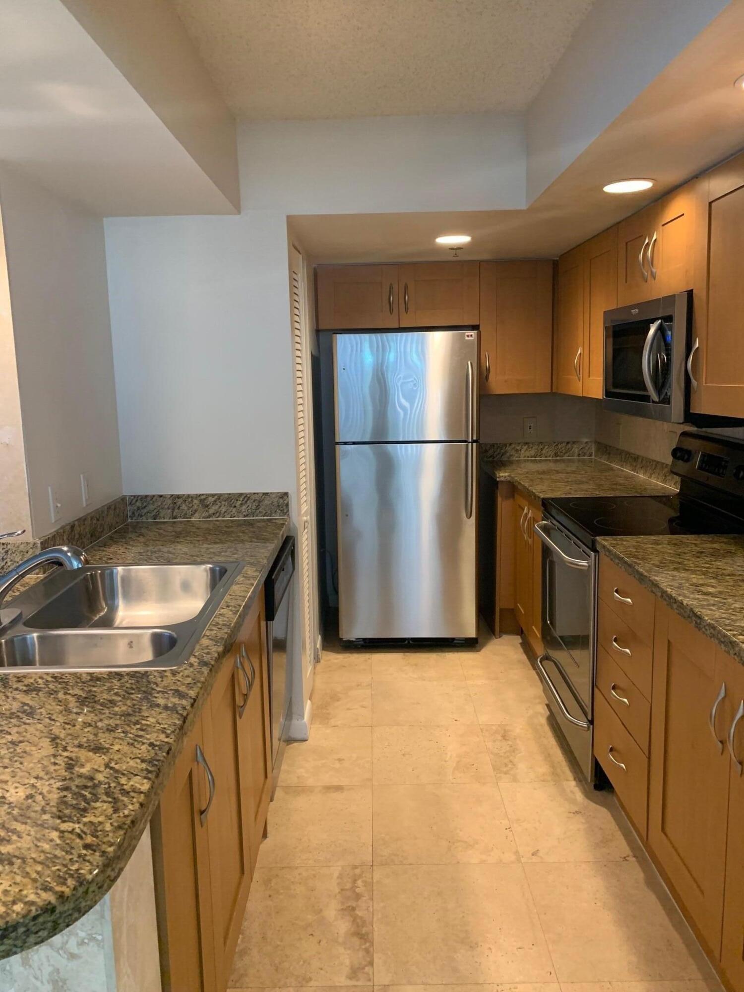 ''PRICED TO SELL'', owner moving out of state. spacious 3 bedroom & 3 full baths, (3rd bedroom perfect for office or nursery) with CARPORT & uncovered space. Enjoy cooking & entertaining with your wonderful open kitchen layout including stainless steel appliances, granite countertops w/travertine backsplash, which wraps around the island and up the accent wall. Also included in this fully upgraded home; private screened terraces , full size washer/dryer, all custom walk-in closets, travertine throughout with luxury vinyl plank in bedrooms, marble in bathrooms, custom mirrors everywhere you look, & upgraded lighting. This community offers resort style swimming pool w/sundeck & spa, Tikki hut hut for picnic/grilling , controlled access entry with manned guard , children's playground,