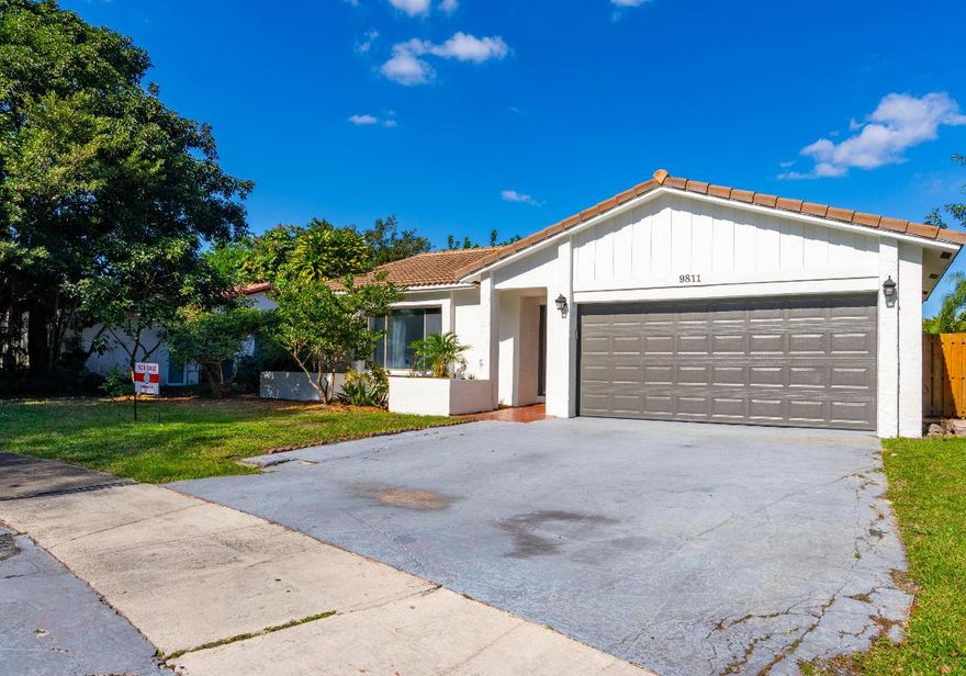 PRICED TO SELL!!!  OVERSIZED LOT and POOL Home in Central Coral Springs along the University Corridor! Highly sought out location for buyers looking to reside in award winning Coral Springs Florida. Just a short bike ride or walk to all of the retail shopping and dining options that University is known for. Mullins Park is also walking distance which is known for excellent sports, leisure, and exceptional green space. NO HOA! The owner has installed NEW FLOORING and the property is in move in condition.