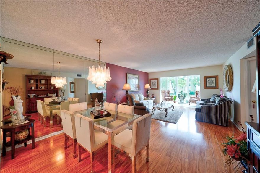 Fully furnished waterfront second floor Juniper model 2br/2bth Condo in active adult 55+ community of Wynmoor! Extended kitchen cabinets with pullout drawers and granite countertops, all hurricane impact windows, two large walk-in closets, washer/dryer in unit, laminate floor throughout, guest room with custom built-in iluminated wall unit. This 24/7 patrolled gated community features: 18-hole golf course, clubhouse, restaurant, tennis/pickleball courts, 962 seat theater, state of the art fitness center, Zumba classes, billiards center, 18 heated pools, hot spa, resistance pool, barbecue stations, shuttle bus service. 80 different clubs to meet new friends and enjoy life in the tropical paradise of Wynmoor! Condo shows like a model and is in move-in condition, bring your fussiest buyer!