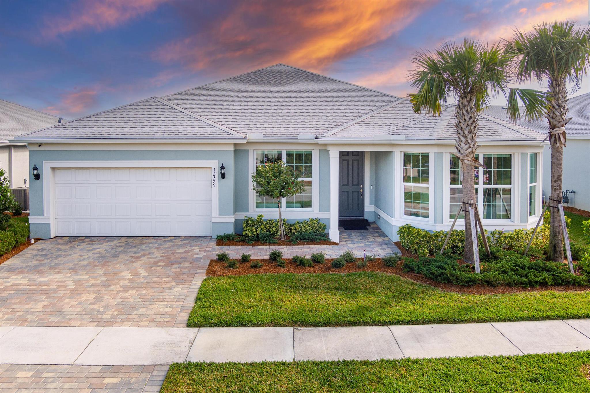 This beautifully designed 2023 build home offers a modern style with breathtaking lake views. Large open concept layout. Home is secured w/ IMPACT windows and & Smart home security package & 3 car tandem garage. Gourmet kitchen is equipped with stainless steal appliances, quartz counters, 42'' cabinets and a large walk in pantry. Expansive master suite w/ water views & an oversized walk in closet. Master bath offers dual sinks, lots of storage & huge walk in shower. Enjoy a triple split bedroom floorplan, w/ large rooms. Home is move in ready! HOA includes resort style pool, sidewalks, security system monitoring, expanded basic cable, lawn care, & play area. Close to shopping, schools, medical, restaurants, & dog park. Tradition's has so much to offer. Subject to Short Sale bank approval.