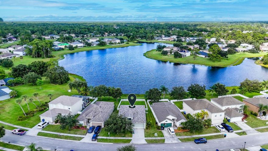 NEW ROOF, NEW HVAC, New Electric Stove, Remodeled Kitchen, with Lakefront Views in Palm Bay's Gated Bridgewater at Bayside Lakes!

Discover this stunning lakefront home in the exclusive, gated community of Bridgewater at Bayside Lakes! Move-in ready, this home offers breathtaking views and a lifestyle that blends comfort, elegance, and Florida charm.

Step inside to an open-concept floor plan featuring a spacious formal living and dining area, tile flooring throughout, and a bright family room overlooking the lake. The remodeled kitchen boasts new countertops,newer appliances including a brand-new electric stove, perfect for cooking and entertaining. Sliding glass doors open to a large, epoxy-finished patio (2025) that spans the entire back of the home, ideal for relaxing, dining, o