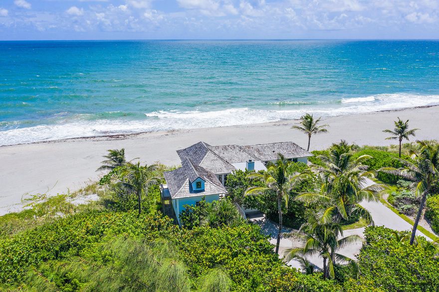 This charming, private Jupiter Island beach cottage is directly on the sand and has wide expansive ocean views east, south, and north of the turquoise Atlantic. The house was thoroughly renovated in 2014 and features impact windows and doors, Hardi plank siding and new kitchen and baths. Wrap around decks to watch the glorious sunrises and sunsets