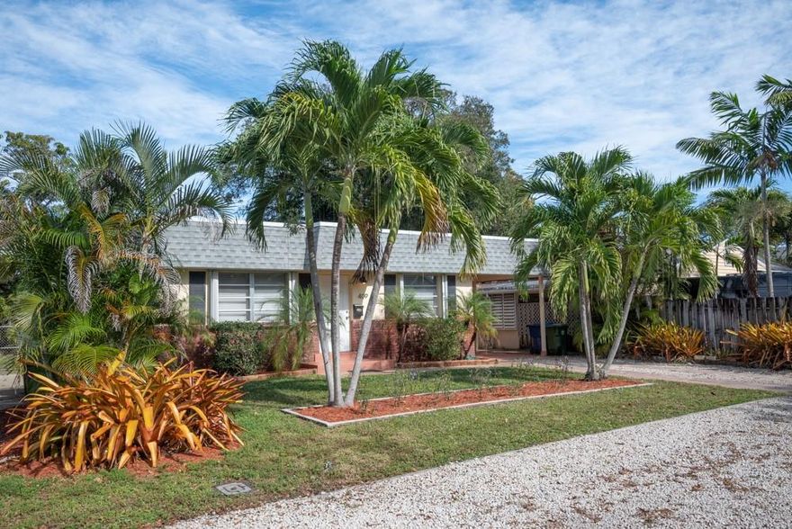 LOCATION, LOCATION, LOCATION.  Don't miss the opportunity.  This fantastic well maintained 3 bedroom 2 bath home is just steps away from Wilton Drive! Some features include: Beautiful laminate flooring throughout; new dishwasher; Hurricane shutters; updated master bathroom; This light and bright, freshly painted home is a GEM!So much room in the back yard for a pool.   Huge shed in back yard and separate laundry room in the carport.   Property is close to beaches, restaurants, night live or just taking a casual walk along the drive!  Seller is accepting multiple offers.