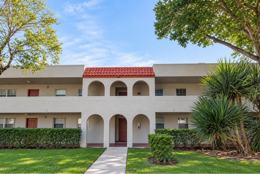 Photo of 7355 Woodmont Terrace #104, Tamarac, FL 33321 (MLS # B26079243)