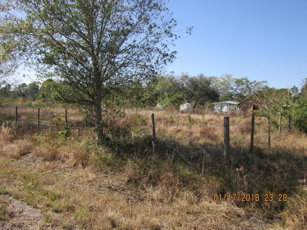 Lot is surveyed and cleared,Well water Fenced and ready for your plans. Sign at the property.
