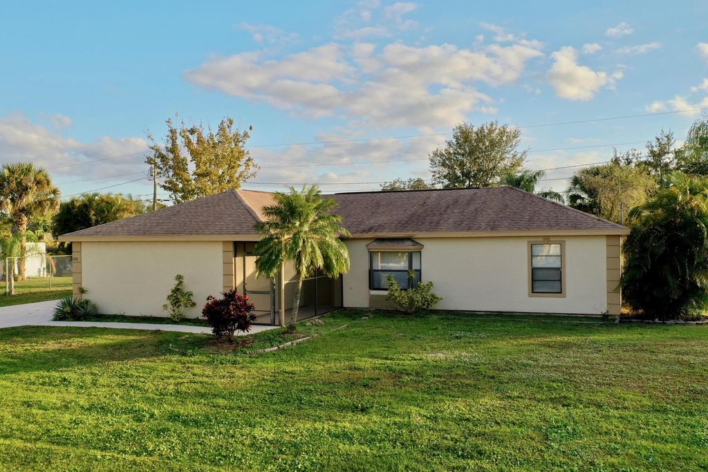 Photo of 1034 SW Cornelia Avenue SW, Port Saint Lucie, FL 34953 (MLS # R10767545)