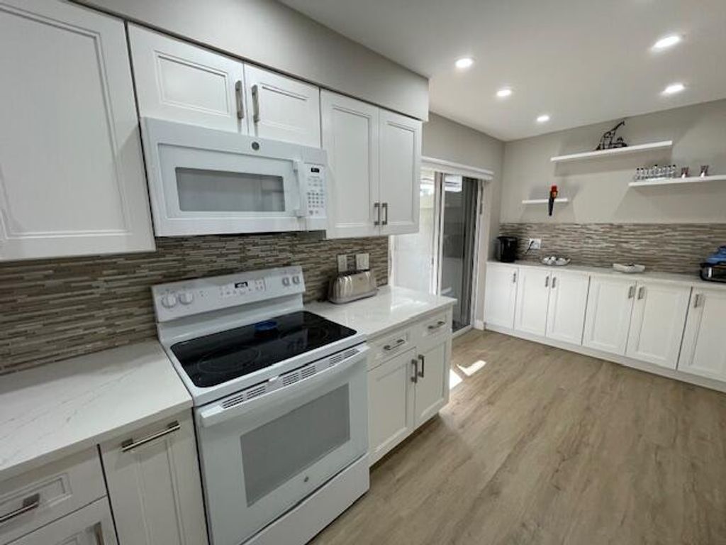 Photo of 7669 Springwater Pl #102, Boynton Beach, FL 33437 (MLS # R11169937)