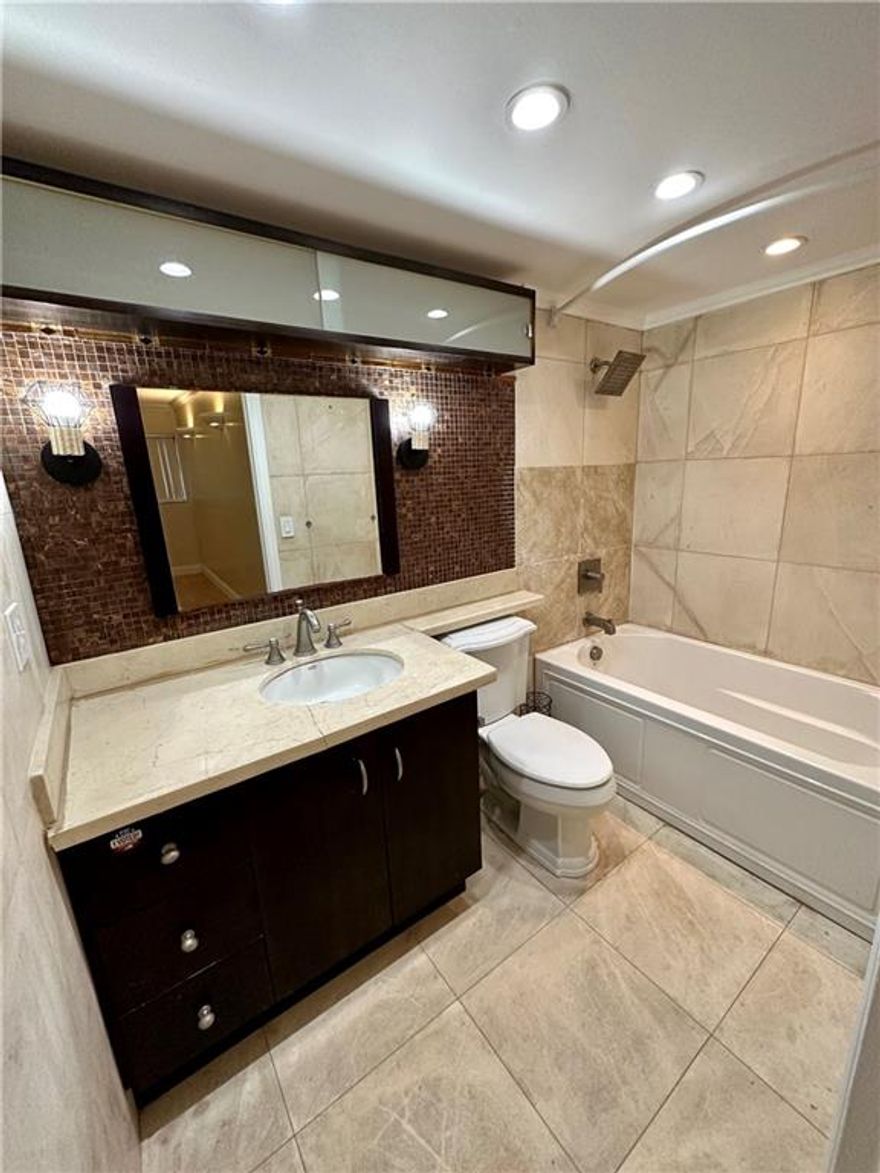 Rarely available Gated ground floor 2 bed 2 bath w laundry room and 2 walk-in closets, ensuite bathroom and screened porch with outside access. What else can you ask from an apartment? Community pool is just a few steps from the unit. Click below to schedule your showings. Access to turnpike and I-95 in no time. Aventura Mall is just a 10 min drive.