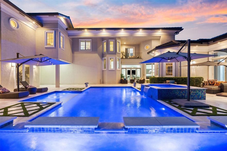 YOU WON'T WANT TO MISS THIS INCREDIBLE OPPORTUNITY! SUBSTANTIAL PRICE IMPROVEMENT! WELCOME TO AN EXTRAORDINARY CUSTOM COURTYARD HOME LOCATED IN THE COVETED INNER CIRCLE OF PRESTIGIOUS HAWKS LANDING! METICULOUSLY RENOVATED WITH ITS TOP-TIER UPGRADES* 1ST FLOOR FEATURES A GRAND PRIMARY SUITE WITH HIS/HERS BATHS, AN ADJACENT PRIVATE OFFICE + GUEST HOUSE AND 4 SPACIOUS ENSUITE BEDROOMS AND A VERSATILE LOFT UPSTAIRS* DESIGNED FOR SEAMLESS INDOOR-OUTDOOR LIVING, SHOWCASING A SPECTACULAR HEATED POOL AND SPA, AND OUTDOOR SUMMER KITCHEN, MAKE THIS AN ENTERTAINER'S DELIGHT* EVERY DETAIL HAS BEEN THOUGHTFULLY CURATED-DESIGNER FINISHES, IMPACT GLASS, AND EVEN A FULL-HOUSE GENERATOR* THIS IS MORE THAN A HOME—IT’S A STATEMENT OF LUXURY AND WORDS CAN’T CAPTURE ITS BEAUTY* YOU MUST SEE IT TO BELIEVE IT!!!