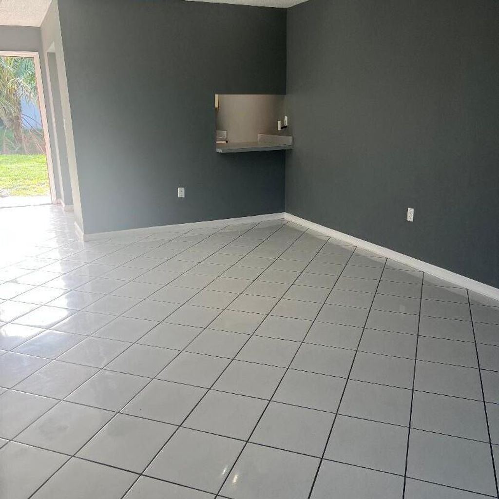 Photo of 6106 Forest Hill Blvd #102, West Palm Beach, FL 33415 (MLS # R11097441)