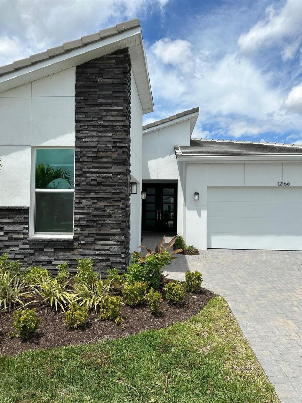 Photo of 12166 Viridian Boulevard, Port Saint Lucie, FL 34987 (MLS # R10979243)