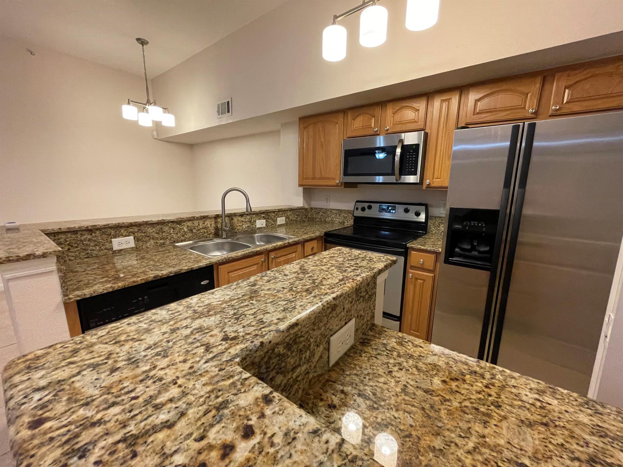 BEAUTIFUL LAKE VIEW Move in ready! This 2/2 features Living room tile, vaulted ceiling, view of the lake from sliding door to the balcony, Kitchen feature granite counters and backsplash and all stainless appliances. Washer and Dryer in separate laundry room off kitchen. Bedrooms carpet, Bathrooms have granite counters and master bath has a Tub. There is a separate locker storage room outside the front door. Unit wil be professionally cleaned prior to final walk through. Unit is vacant and very easy to show. First, last and security required for move in. Credit score minimum 600. If you decide to apply, send me proof of income, screenshot of credit score and copy of ID. Gated community with Clubhouse, pool, fitness center, picnic area and child playground. Must to see!!!!