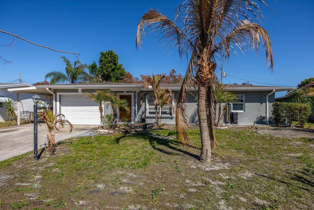 Photo of 403 NE Oleander Avenue, Port Saint Lucie, FL 34952 (MLS # B26005851)