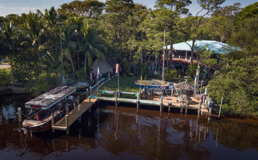 Located in the heart of Tequesta, at the very end of a tranquil tree-lined street, this quarter acre lot has spectacular wide intracoastal views. This unique three bedroom two and half bath tropical hideaway and Robinson Crusoe treetop ''lookout'' is nestled among magnificent trees, overlooking the Loxahatchee River. This waterfront home affords privacy, mesmerizing views and unlimited possibilities. A hidden '' slice of heaven'' that allows you to escape reality, kick back and relax. Property is being sold ''AS IS.'' Please note: Molly Roger's boat is not included in the sale.