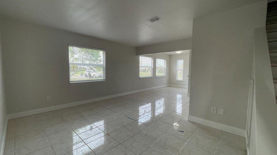 Welcome to this spacious 2-bedroom, 2.5-bathroom unfurnished townhouse, perfectly situated near the beach and downtown Fort Pierce. This annual rental offers an open-concept living space, a fully equipped kitchen, and a private patio. Upstairs, you'll find two roomy bedrooms. Enjoy the convenience of being in close proximity to the beach and the vibrant nightlife and entertainment of downtown Fort Pierce. This is a great opportunity for long-term living in a desirable location.