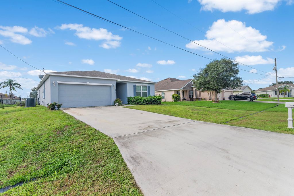 Photo of 574 SW Lacroix Avenue, Port Saint Lucie, FL 34953 (MLS # R11019995)