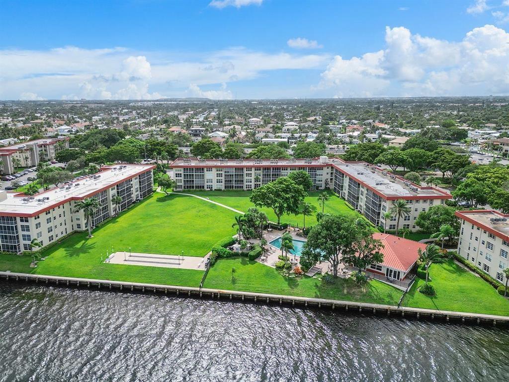 BEST PRICE FOR 3 BEDROOMS ON INTRACOASTAL!! Enjoy the Great Views and Waterfront Lifestyle offered from this Top Floor Corner Condo!! Located in Beautiful Palm Aire at Coral Key with 17 acres, Clubhouse and Resort Style Pool right on the Intracoastal. This 3 bed/2 bath unit has all Impact Windows/Doors, Spacious Living Area, Updated Kitchen and Baths, Great Closet Space, and more!! Dockage is offered at $3/ft (Max 42 ft) when available. Maintenance includes extras such as Wi-Fi, Cable, Trash and Water.
**50yr CONCRETE MAINT AND NEW ROOF JUST COMPLETED ON THE BUILDING AND PAID BY SELLER - NO ASSESSMENTS**
