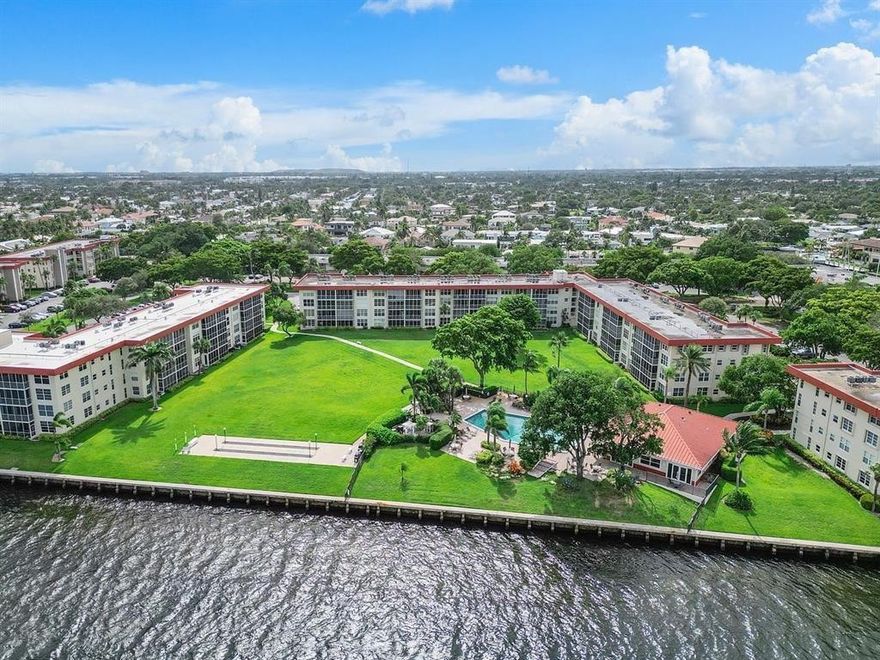 BEST PRICE FOR 3 BEDROOMS ON INTRACOASTAL!! Enjoy the Great Views and Waterfront Lifestyle offered from this Top Floor Corner Condo!! Located in Beautiful Palm Aire at Coral Key with 17 acres, Clubhouse and Resort Style Pool right on the Intracoastal.  This 3 bed/2 bath unit has all Impact Windows/Doors, Spacious Living Area, Updated Kitchen and Baths, Great Closet Space, and more!! Dockage is offered at $3/ft (Max 42 ft) when available.  Maintenance includes extras such as Wi-Fi, Cable, Trash and Water.**50yr CONCRETE MAINT AND NEW ROOF JUST COMPLETED ON THE BUILDING AND PAID BY SELLER - NO ASSESSMENTS**