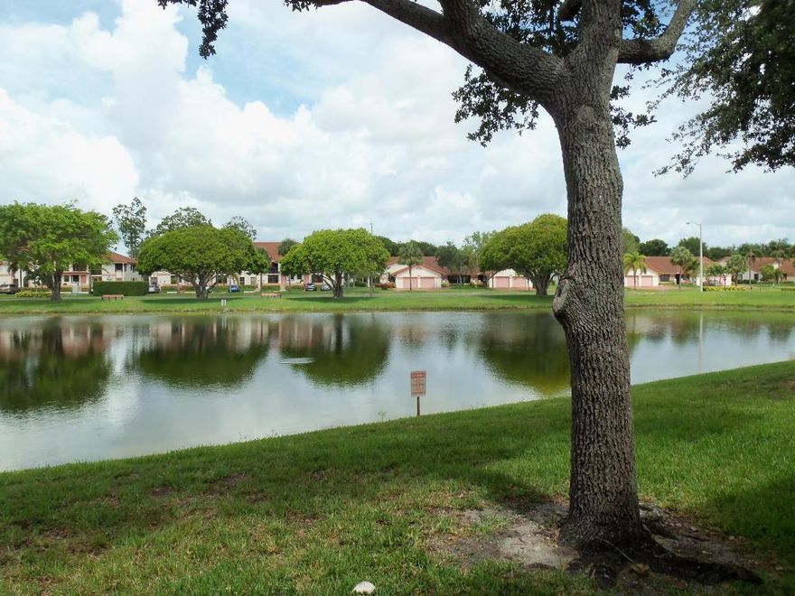 Beautiful and desirable first floor unit overlooking the lake. Immaculately maintained 2/2 + DEN!  Huge master bathroom just remodeled and updated.  Two separate bath vanities.  Lots of closet space.  Tiled floors with wood laminate in both bedrooms. Nice large eat in kitchen with pass through to dining/living area.  Tiled backsplash.   All new Kenmore kitchen appliances less than 1 year old.  Brand new Central A.C. installed April 2016.  New upgraded paneled interior doors also recently installed. Mirrored wall in den.  Nice screen patio with storage area.  Community offers clubhouse, pool, card rooms, fitness center, tennis courts and many clubs to join.  Conveniently located near shopping, restaurants, turnpike and I95.  Furniture is negotiable