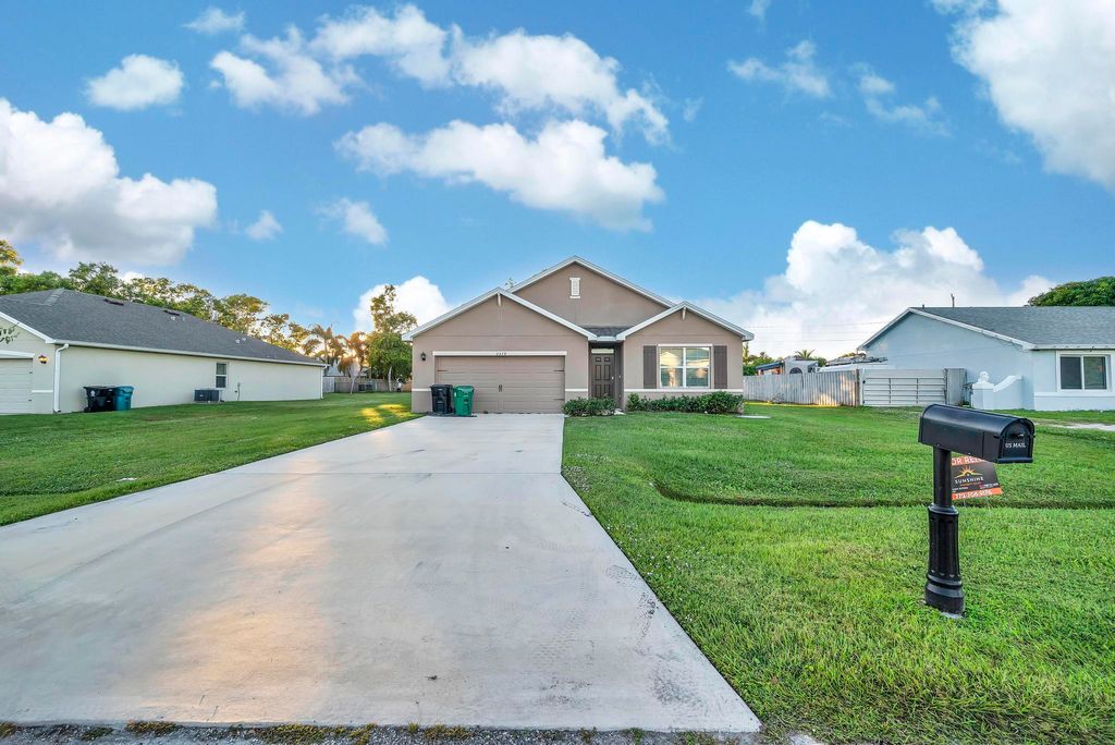 Photo of 2538 SE Rock Springs Dr, Port Saint Lucie, FL 34952 (MLS # B26000656)