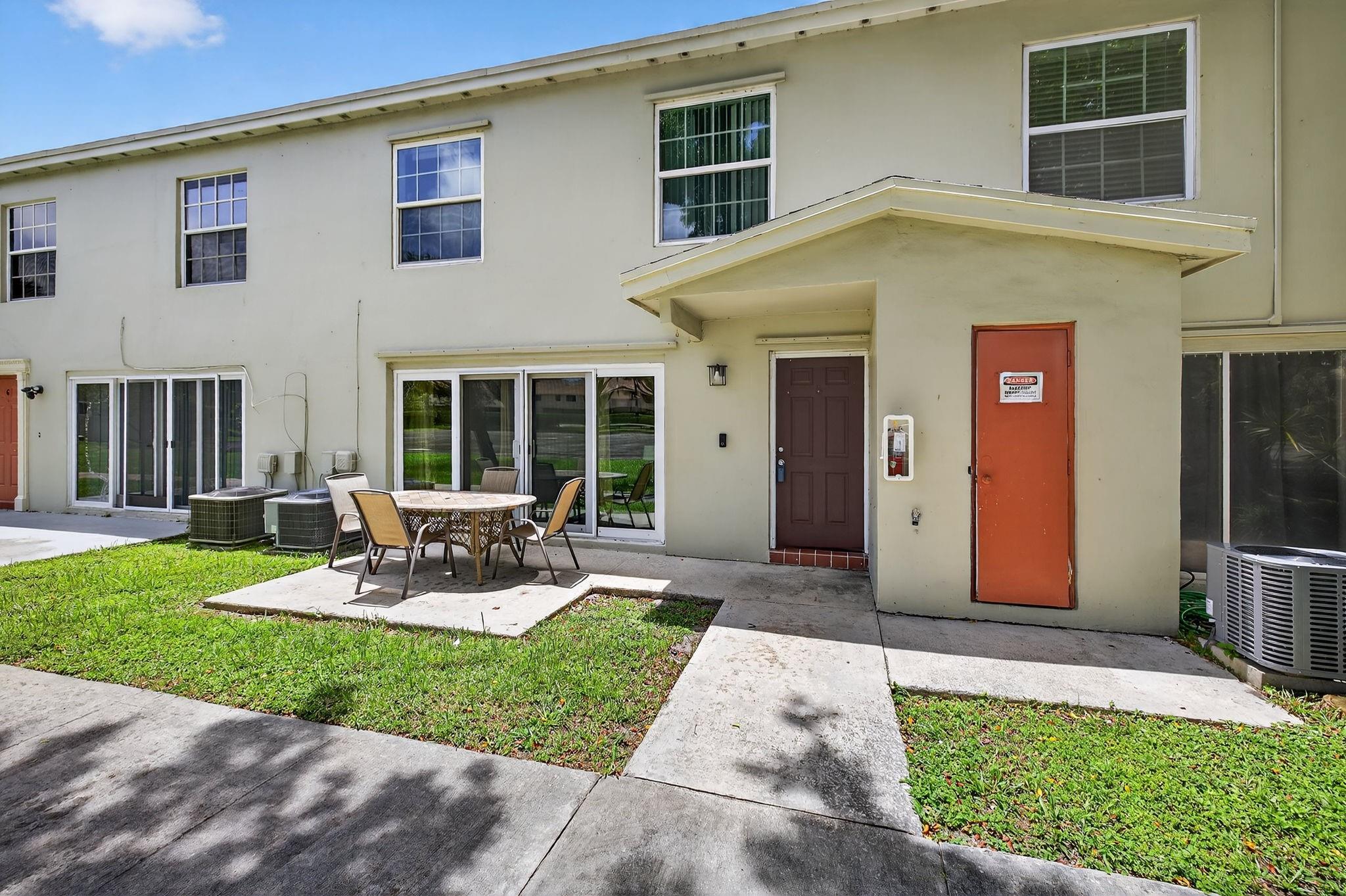 This amazing property feels like a townhouse with 1475 sf of living area, a front patio, and garage!! Lovely updated kitchen boasts white cabinetry, stainless steel appliances and granite countertops. Laminate flooring throughtout. Roof is 2016, impact windows and living room double impact slider opens to outside patio for entertaining, a/c and hot water heater are both 5 years. This home is ready to be yours!! Very affordable HOA. Close to shopping. restaurants, highways. 40 year inspection complete. Reserve study completed; designated reserve fund. This has all the convenience of a townhouse with no one above, and parking inside the garage making groceries, children and rainy days easy!