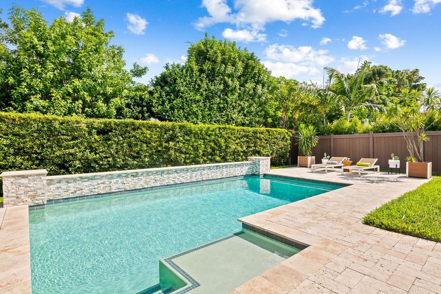 Ask about **SPECIAL FINANCING** that could save hundreds each month (potential to save $200k+ over the life of a 30-yrs loan) with a rate buy-down through a preferred lender. Built in 2013 and just steps from vibrant Wilton Drive, this remarkable home is perfect for today’s “work-live-play” lifestyle - including a LARGE den ideal for a home office or additional BR. The kitchen showcases custom wood cabinetry, Caesarstone quartz counters & backsplash. Enjoy the custom solar-heated saltwater pool, covered lanai & professionally landscaped yards. Other features: vaulted ceilings in the living areas, impact windows, upgraded electric,  dual EV chargers, generator plug-in, 2-car garage & PVC fenced-in yard. No HOA & favorable insurance rates from newer construction help keep monthly costs down.