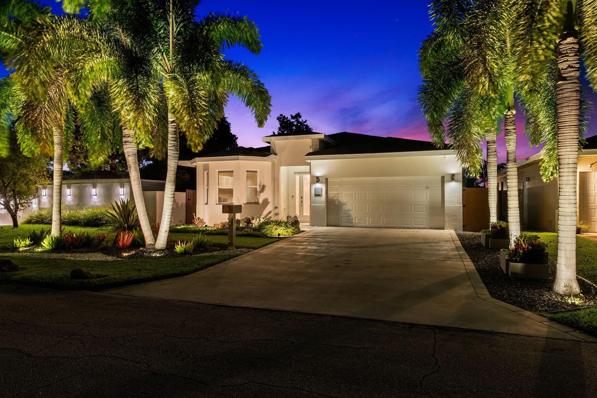 Built in 2013 and steps from vibrant Wilton Drive, step into this remarkable home with 9.5 ft ceilings & vaulted living areas up to 11.5 ft. It's designed for today’s “work-live-play” lifestyle, with a large den as a home office without interfering with the actual living space (see floor plan). The kitchen showcases custom wood cabinetry, Caesarstone quartz counters & backsplash w/ plenty of storage. Enjoy the solar heated saltwater pool, covered patio & professionally landscaped yards with FX LUXOR lighting & smart irrigation. Other features: impact windows, 400 AMP panel, dual Level 2 EV chargers, generator plug-in, laundry room, smart ceiling storage in the 2-car garage, a pet friendly fenced in yard (PVC) and more. A captivating home in an unbeatable location - schedule a private tour.