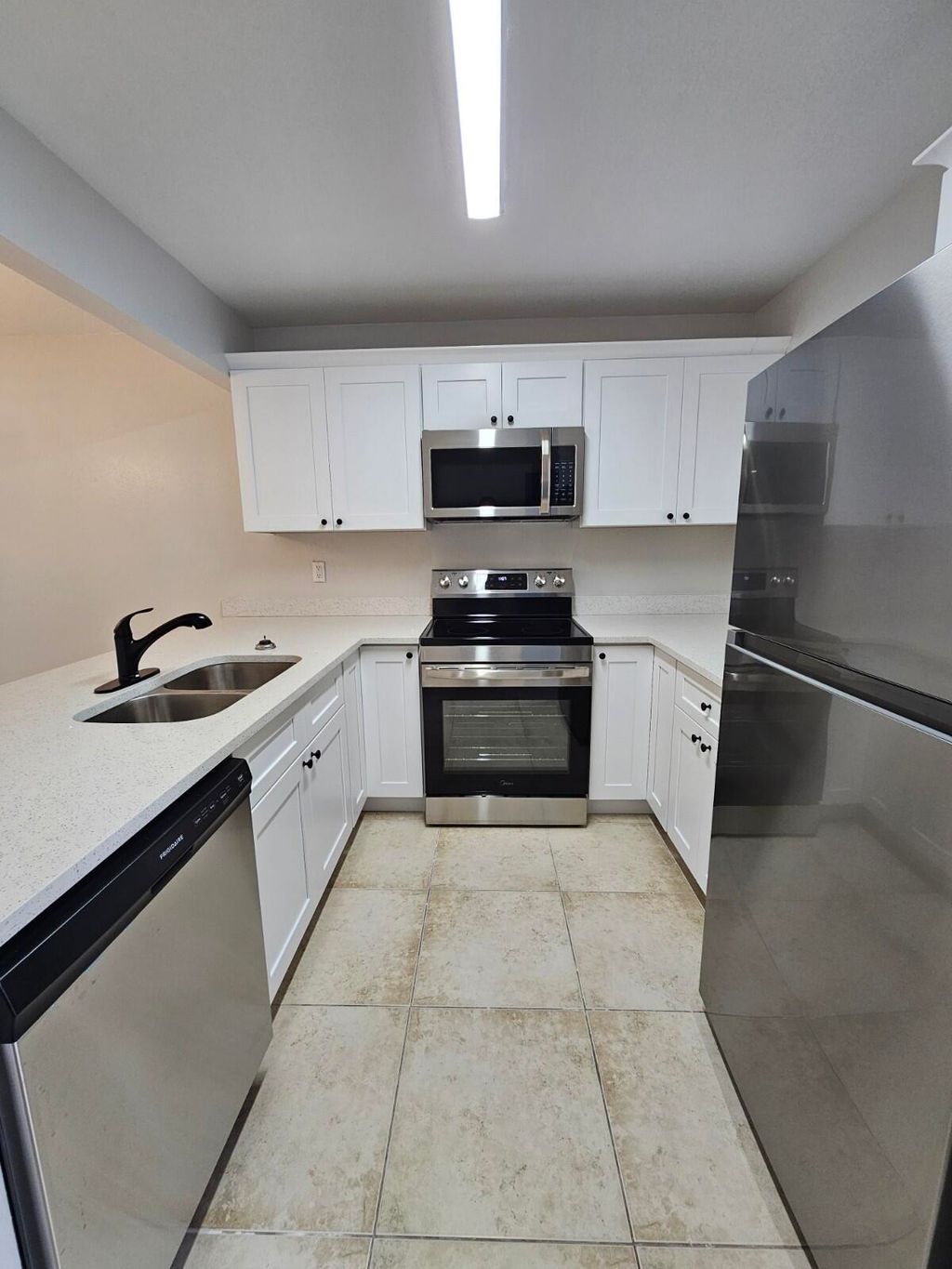 Photo of 1421 Windorah Way #E, West Palm Beach, FL 33411 (MLS # B26023352)