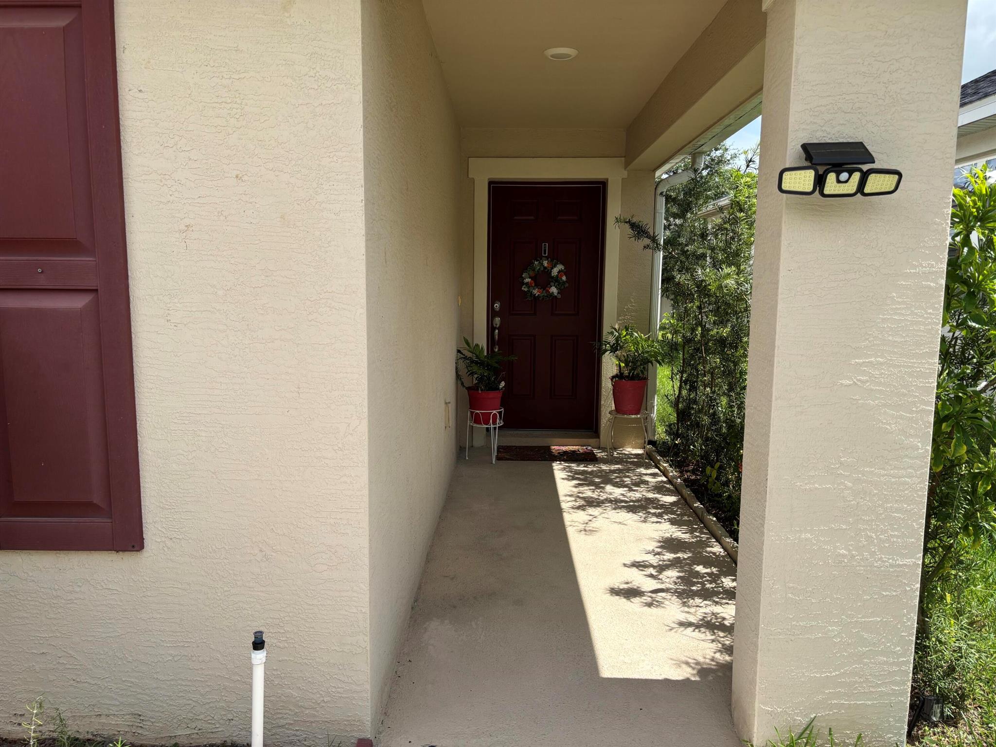 Welcome to your peaceful corner lot, surrounded by natural preserves to the south and west. This quiet, well-kept home is move-in ready and has privacy and scenic views right from your windows.Inside, you'll find tinted windows for added privacy and energy efficiency, plus a complete set of appliances: washer, dryer, fridge, and microwave oven. Security and convenience come with four strategically placed cameras covering the patio, garage, front, and side of the home. The garage also includes built-in shelving for organized storage.