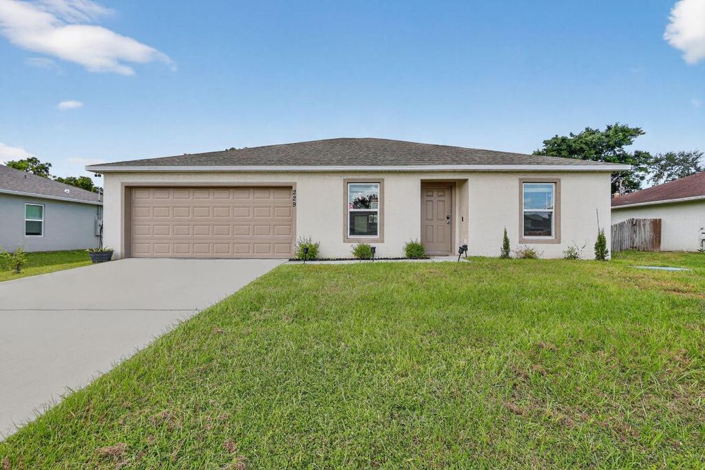 Photo of 229 SW Starfish Avenue, Port Saint Lucie, FL 34984 (MLS # R11133972)