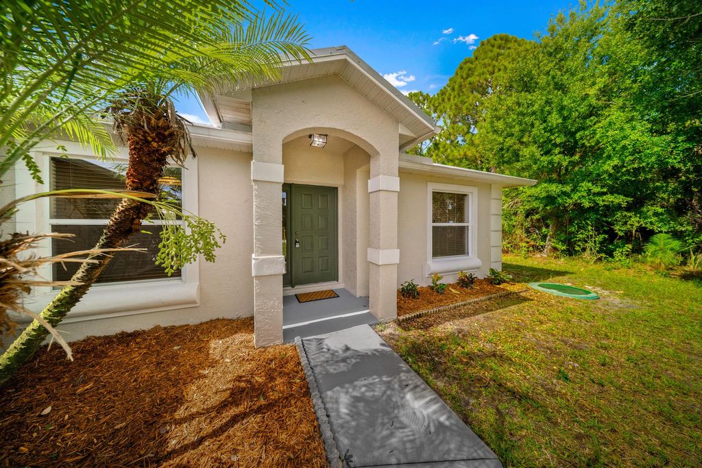 Photo of 5848 NW Bates Avenue, Port Saint Lucie, FL 34986 (MLS # R11110255)