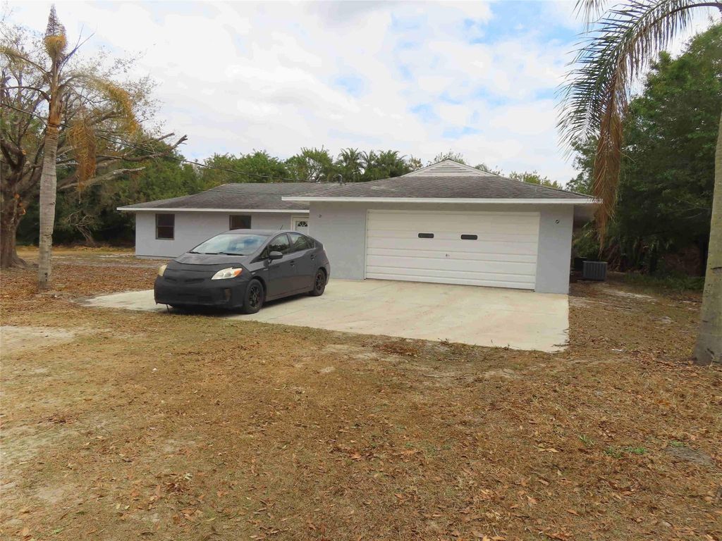 Photo of 18500 Glades Cut Off Road, Port Saint Lucie, FL 34987 (MLS # F10550514)